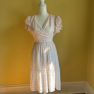 Pink and white polka dot ruffled dress.